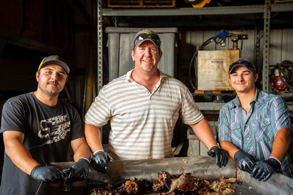 The Forever Vos Farms team pulling meat in the shop
